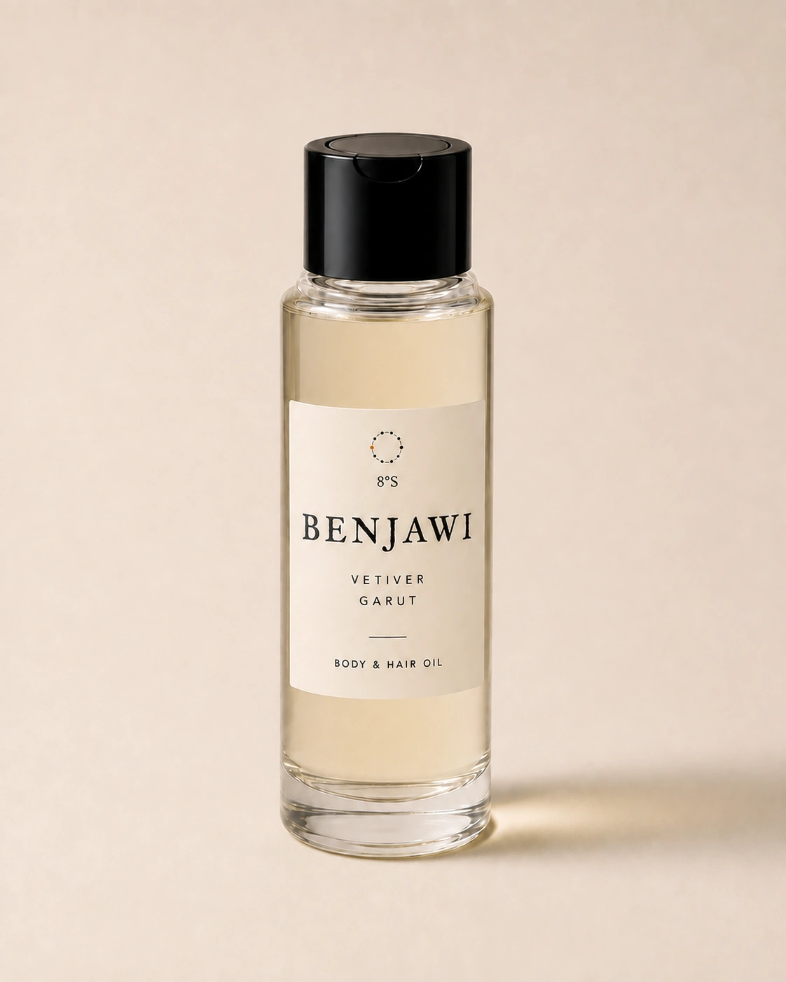 Vetiver Garut body and hair oil in a slender round glass bottle with a black cap.